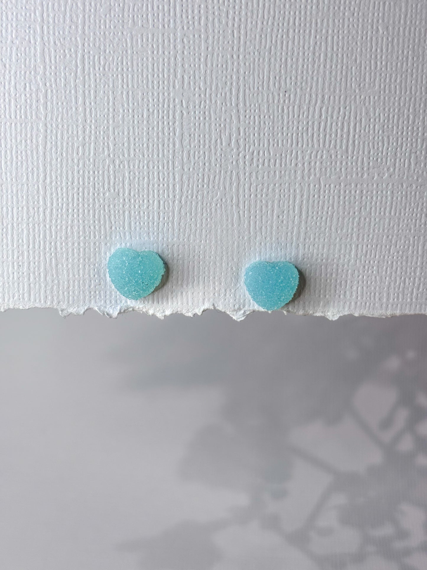 Blue gummy heart studs