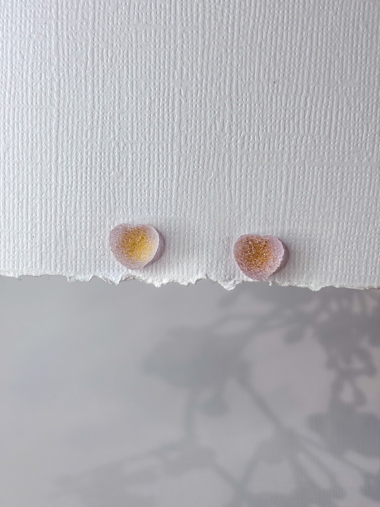 Purple gummy heart studs